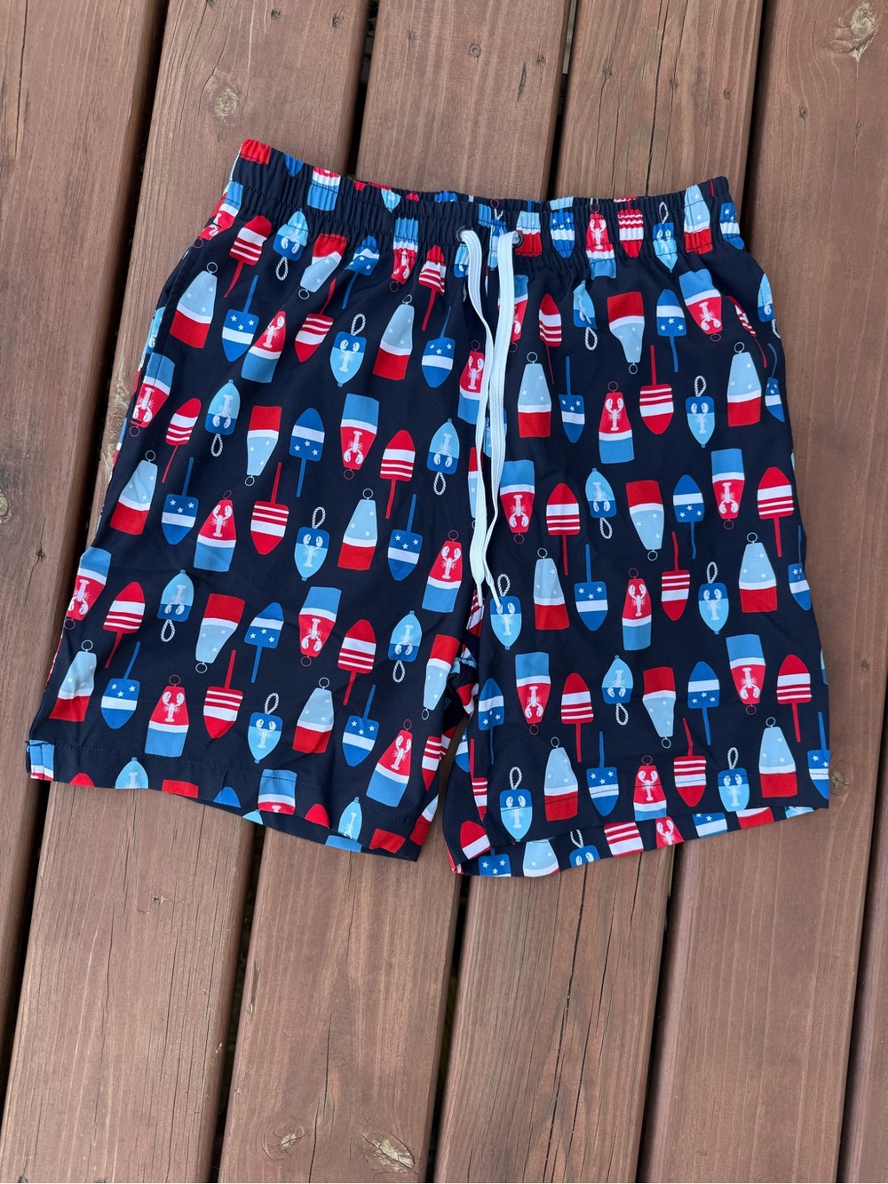 Caribbean Joe Navy Swim Trunks with Red, White & Blue Blue Buoy Print